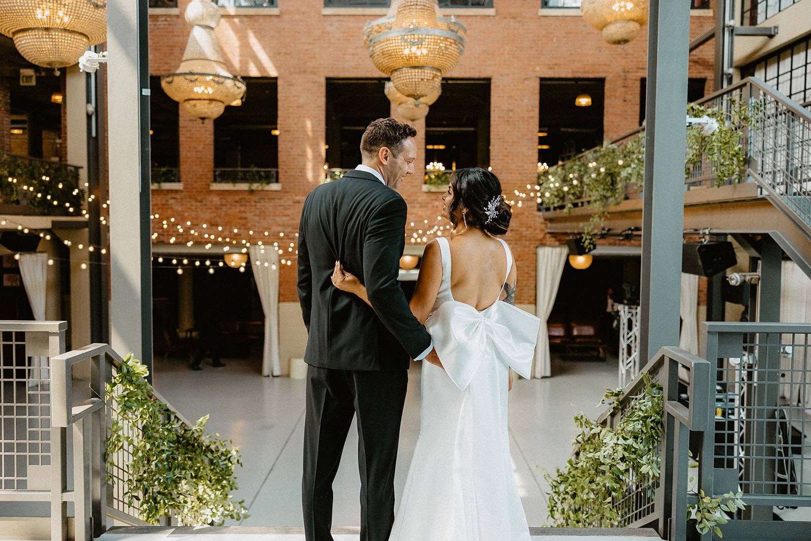 Bride and groom admiring their wedding venue before the ceremony begins.